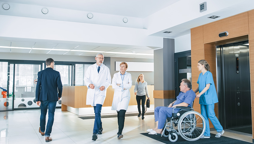 staff walking through a healthcare facility